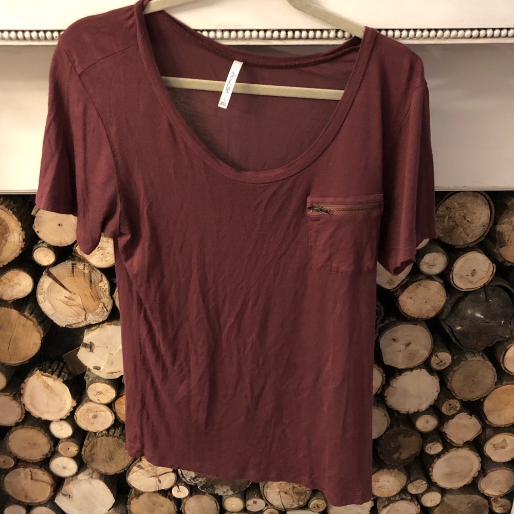 Burgundy top with zip pocket detail